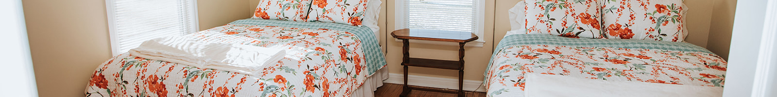 An image depicting the Blooming Meadows Bedroom, one of the bedrooms incorporated into Grandma's House at Circle K Farm